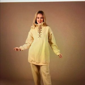 Woven sweat shirt and pant set.